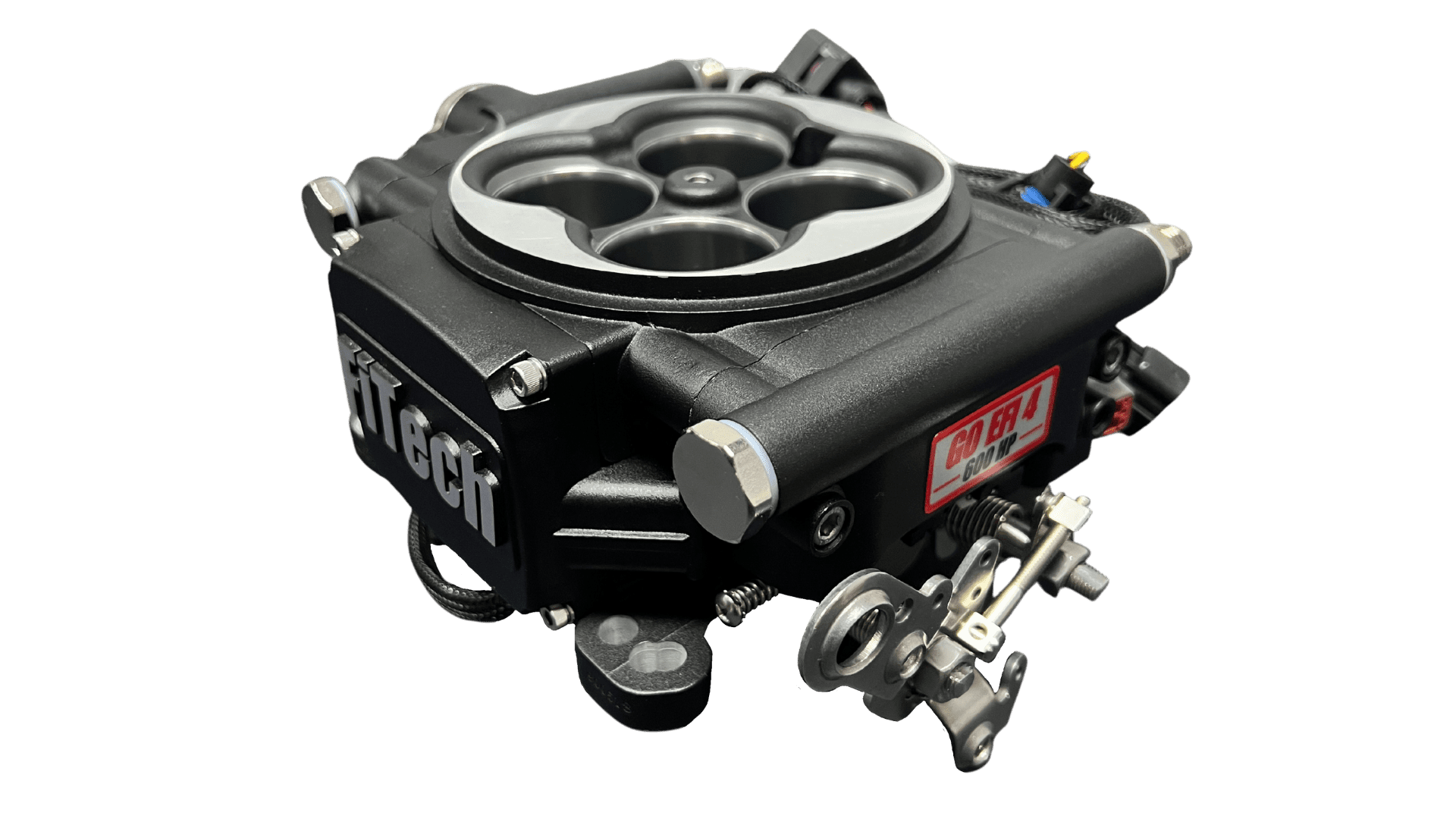 Carburetor on black background, close-up view.