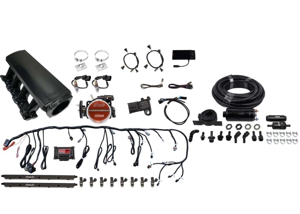 Car engine parts and accessories laid out.