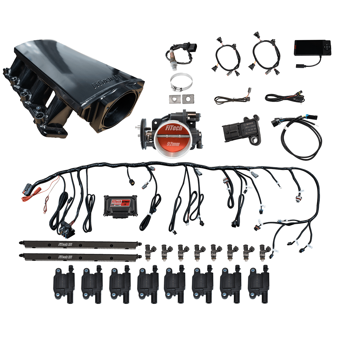 Car engine parts and wiring components.