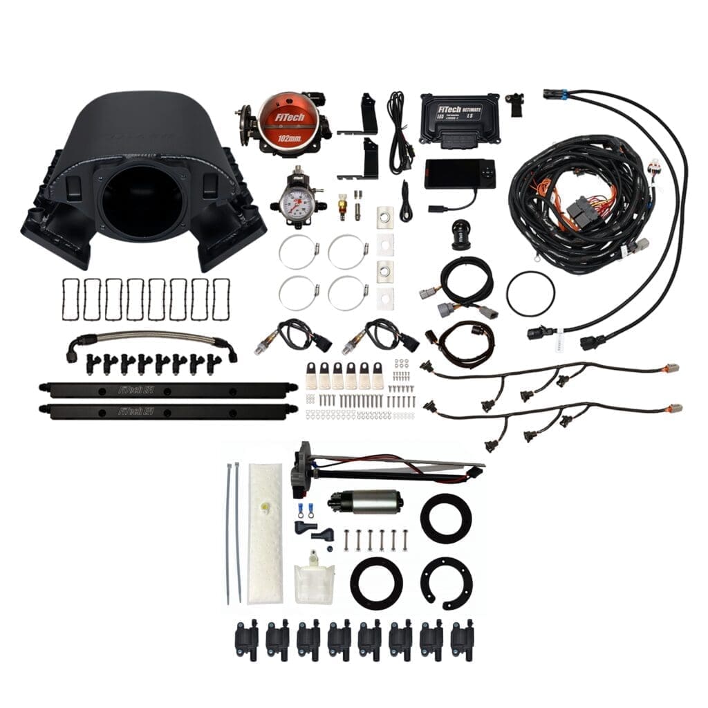 Car engine parts and accessories laid out.