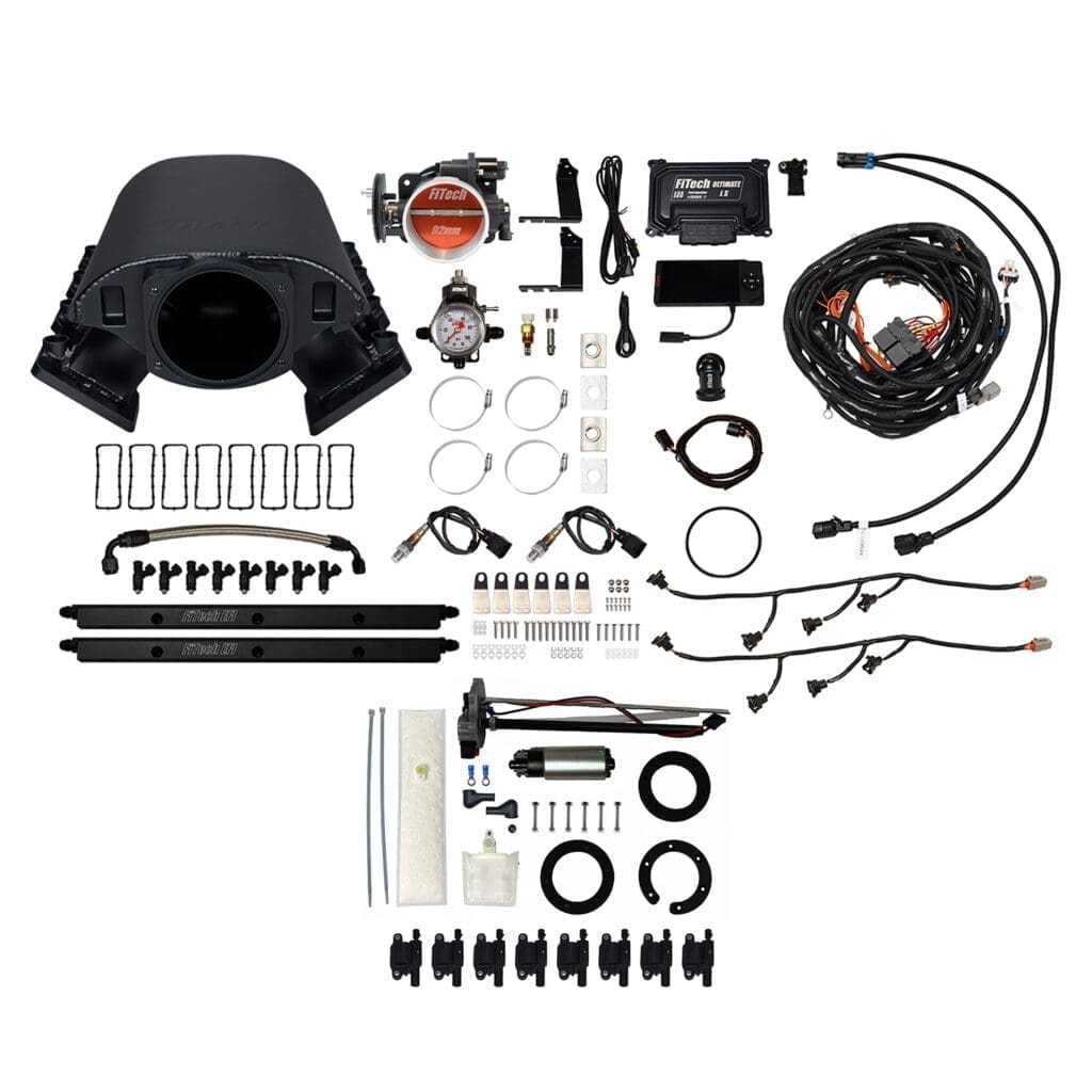 Car engine turbo kit components laid out.