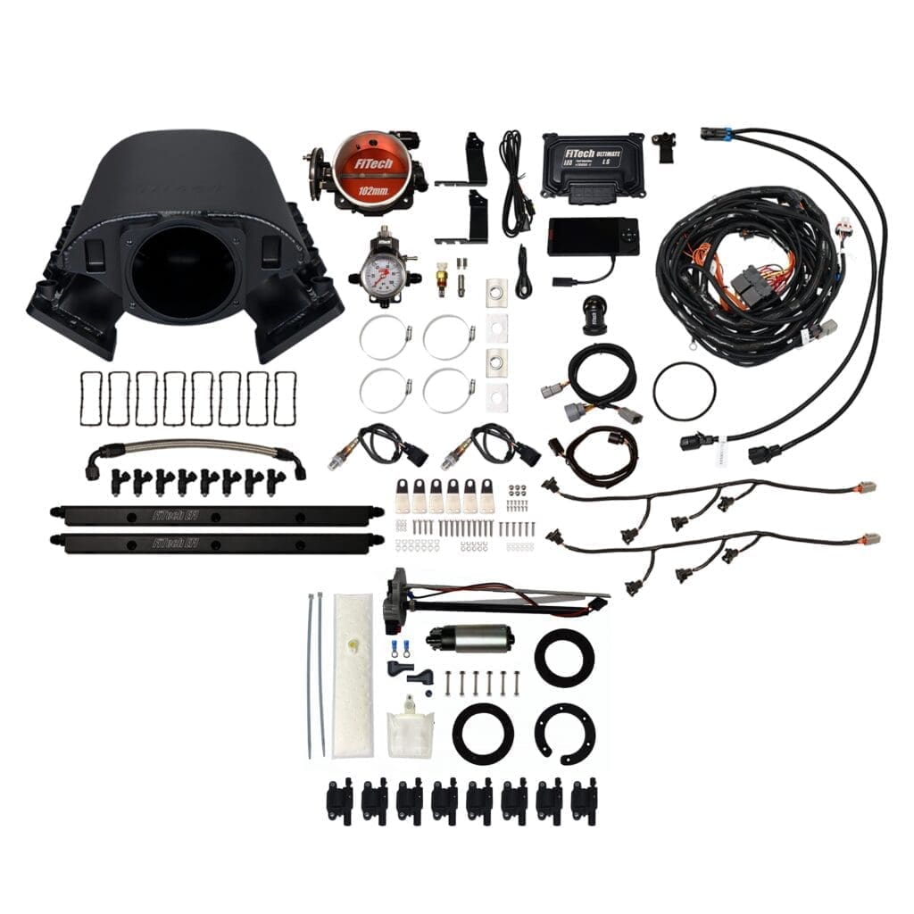 Turbocharger kit with various automotive components.