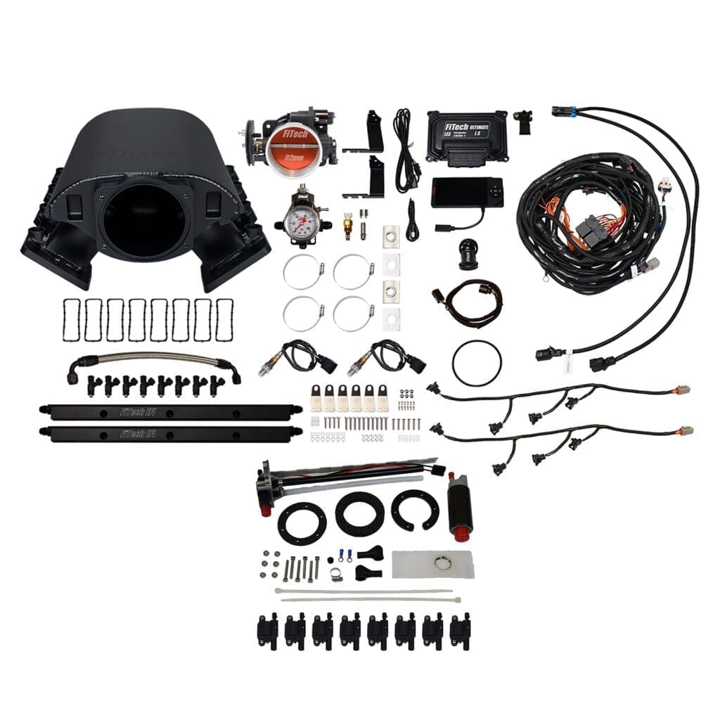 Car engine parts and wiring components displayed.