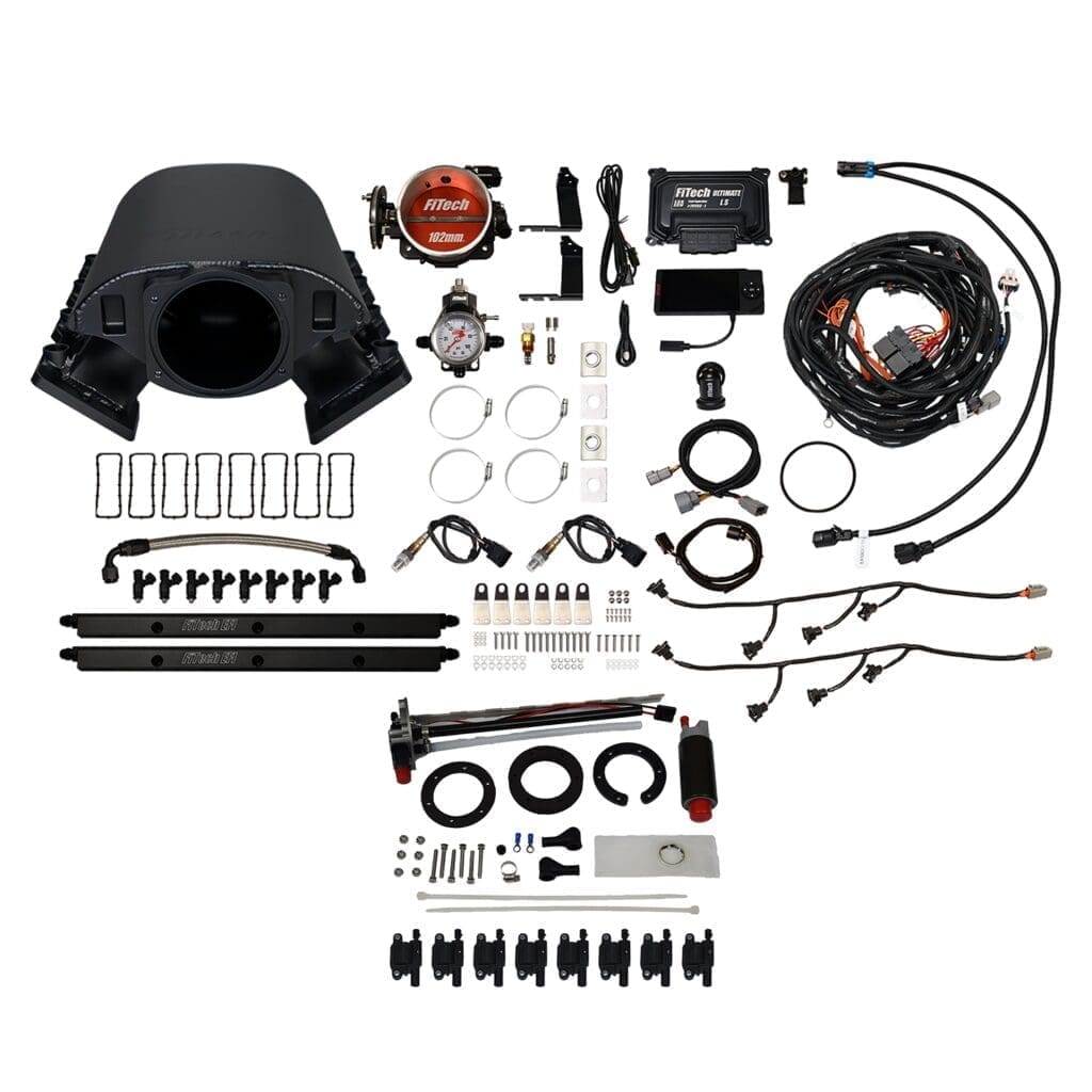 Car engine parts and accessories laid out.