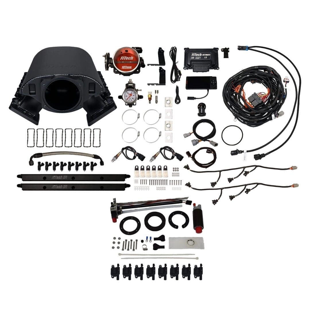 Car engine parts and accessories laid out.