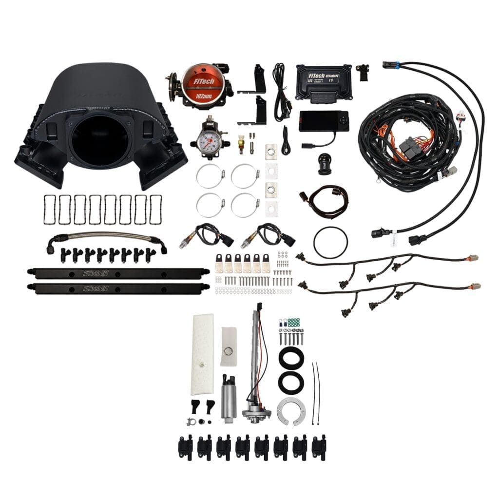 Car engine components and accessories laid out.