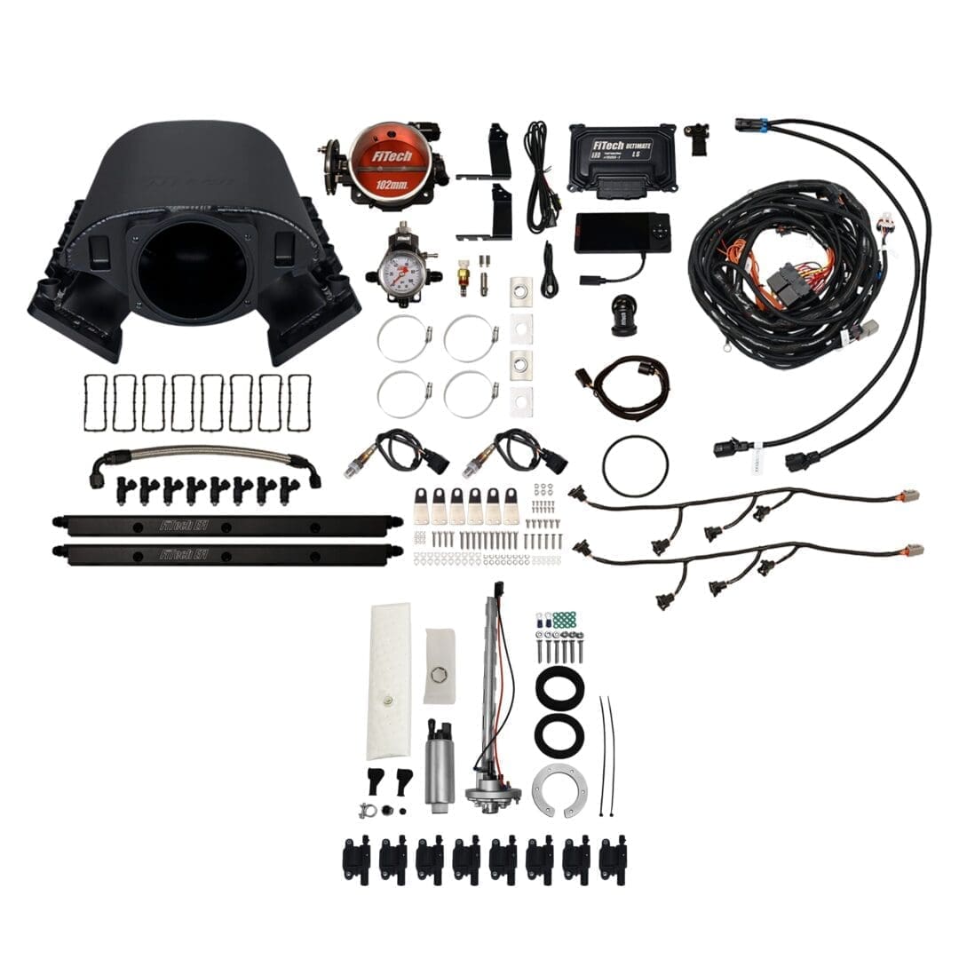Car engine components and accessories laid out.