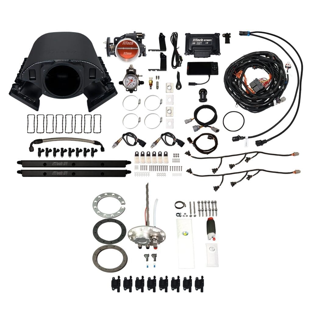Car engine parts and wiring kit displayed.