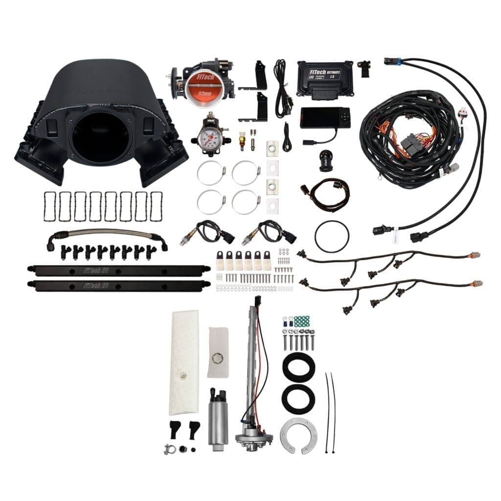 Car engine parts and accessories laid out.