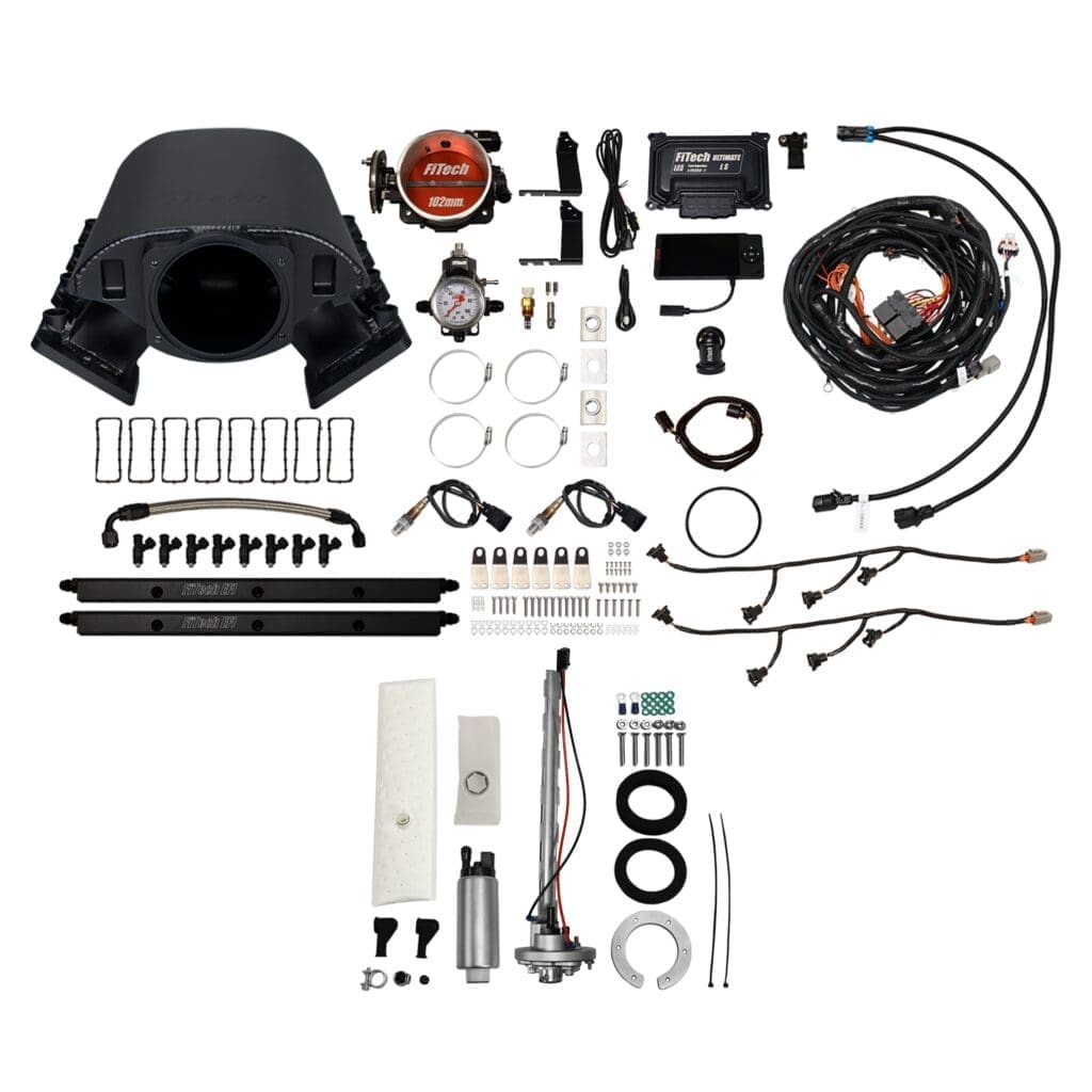 Car engine components and accessories laid out.