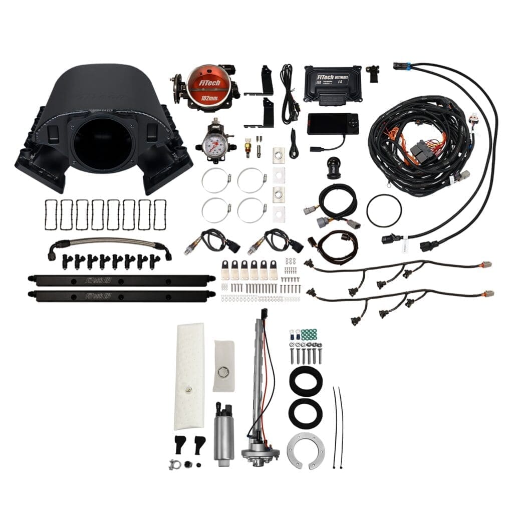 Car engine parts and accessories laid out.
