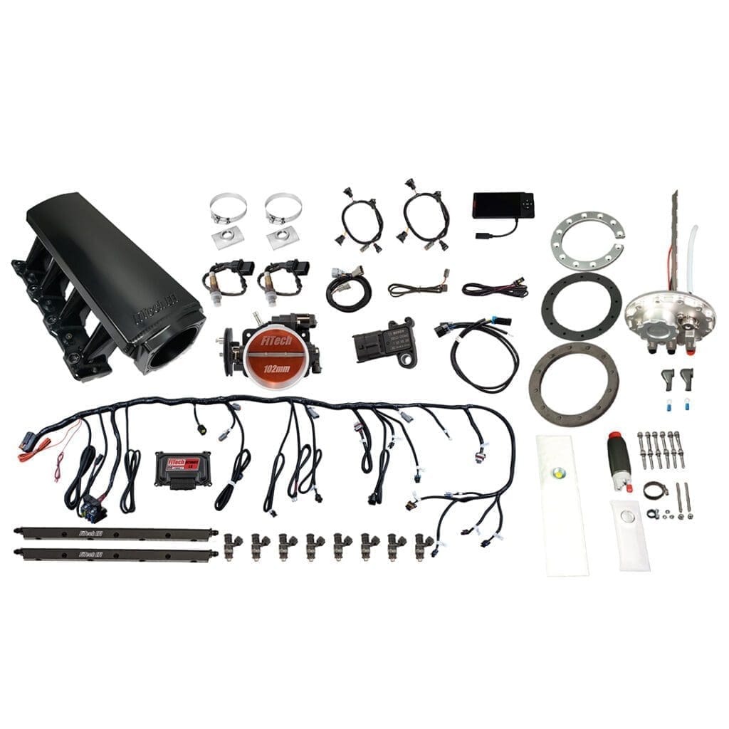 Car engine parts and accessories laid out.