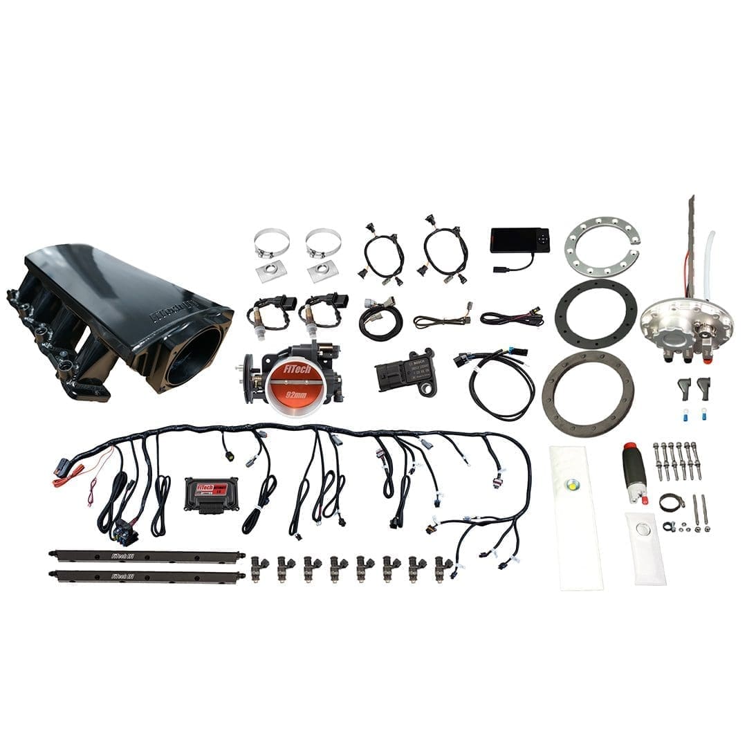 Car engine parts and accessories laid out.
