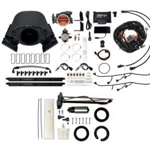 Car engine turbocharger kit components laid out.