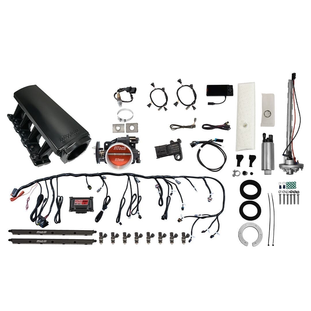 Car engine component kit with various parts.
