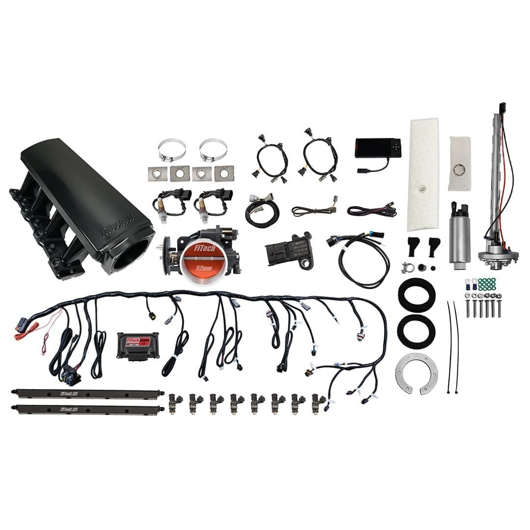 Car engine parts and wiring components displayed.