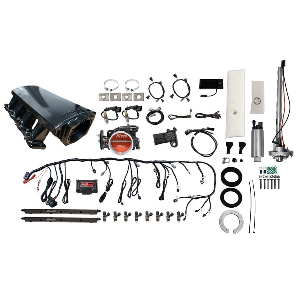 Car engine parts and wiring components displayed.