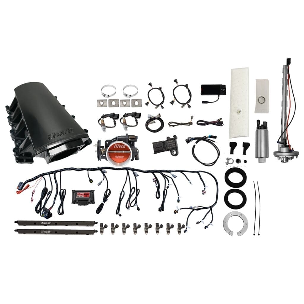 Car engine components and wiring laid out.