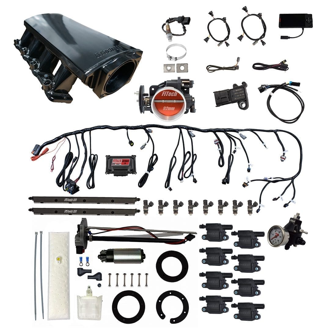 Car engine parts and wiring kit display.