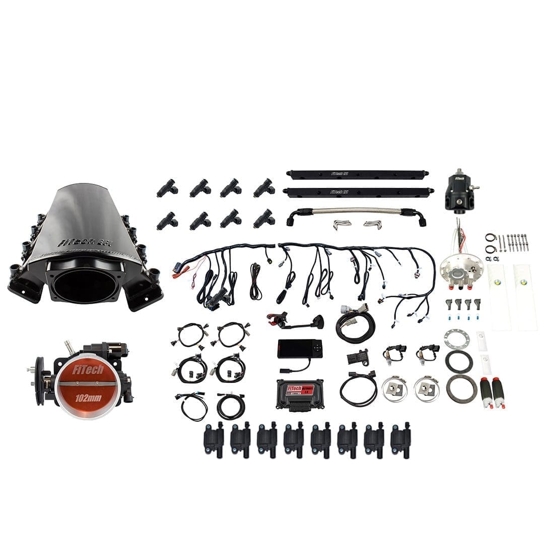 Car engine components laid out on white background.