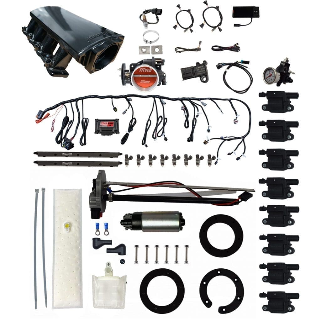 Car engine components and accessories laid out.