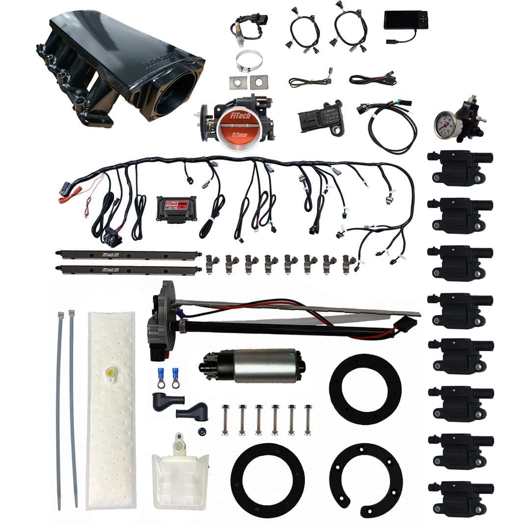 Car engine components and accessories laid out.