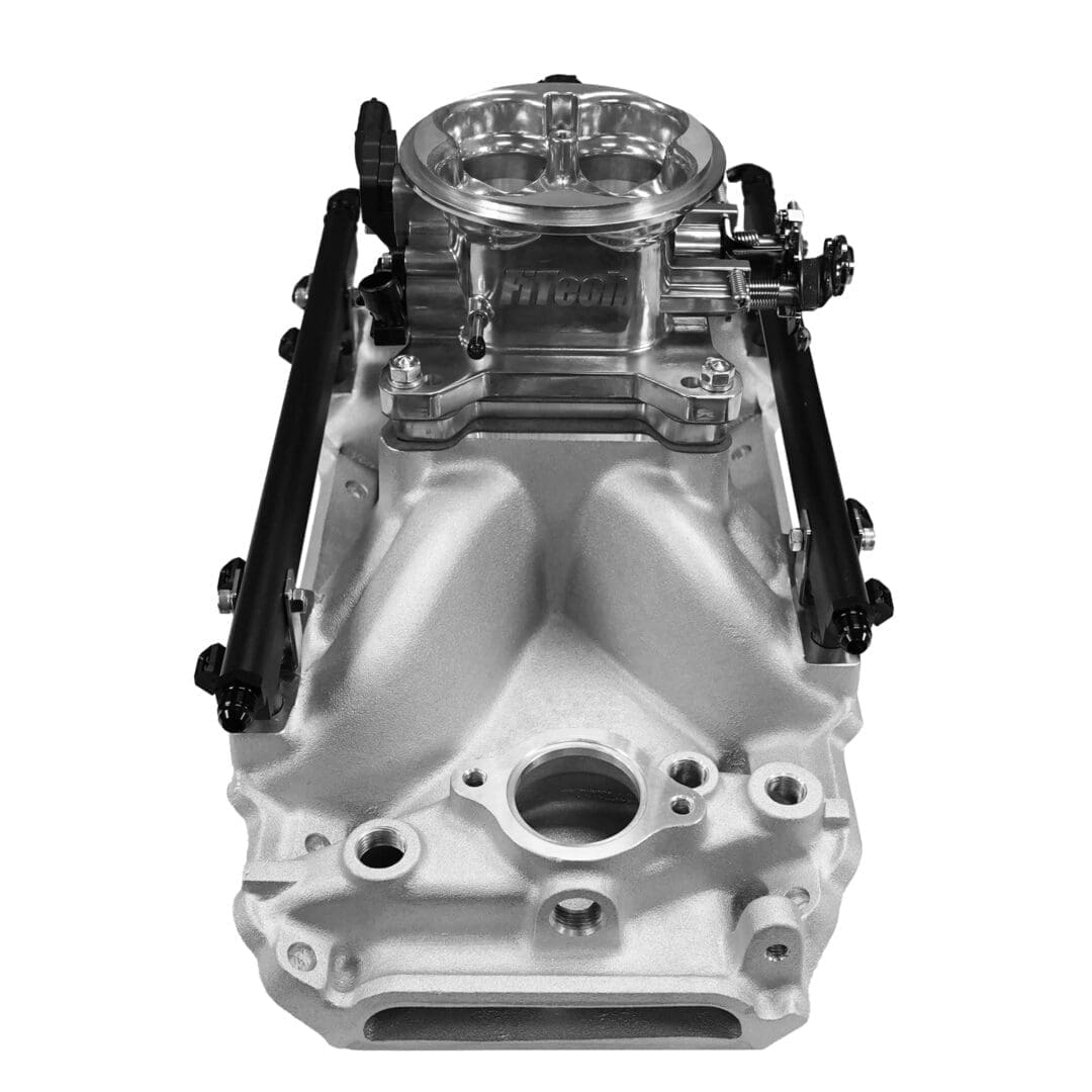 Car engine intake manifold in black and white.