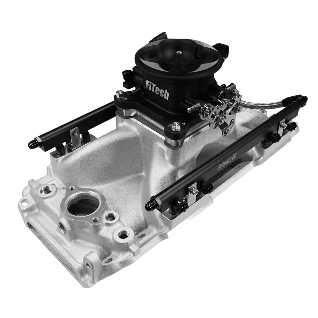 Silver automotive engine component with black fittings.