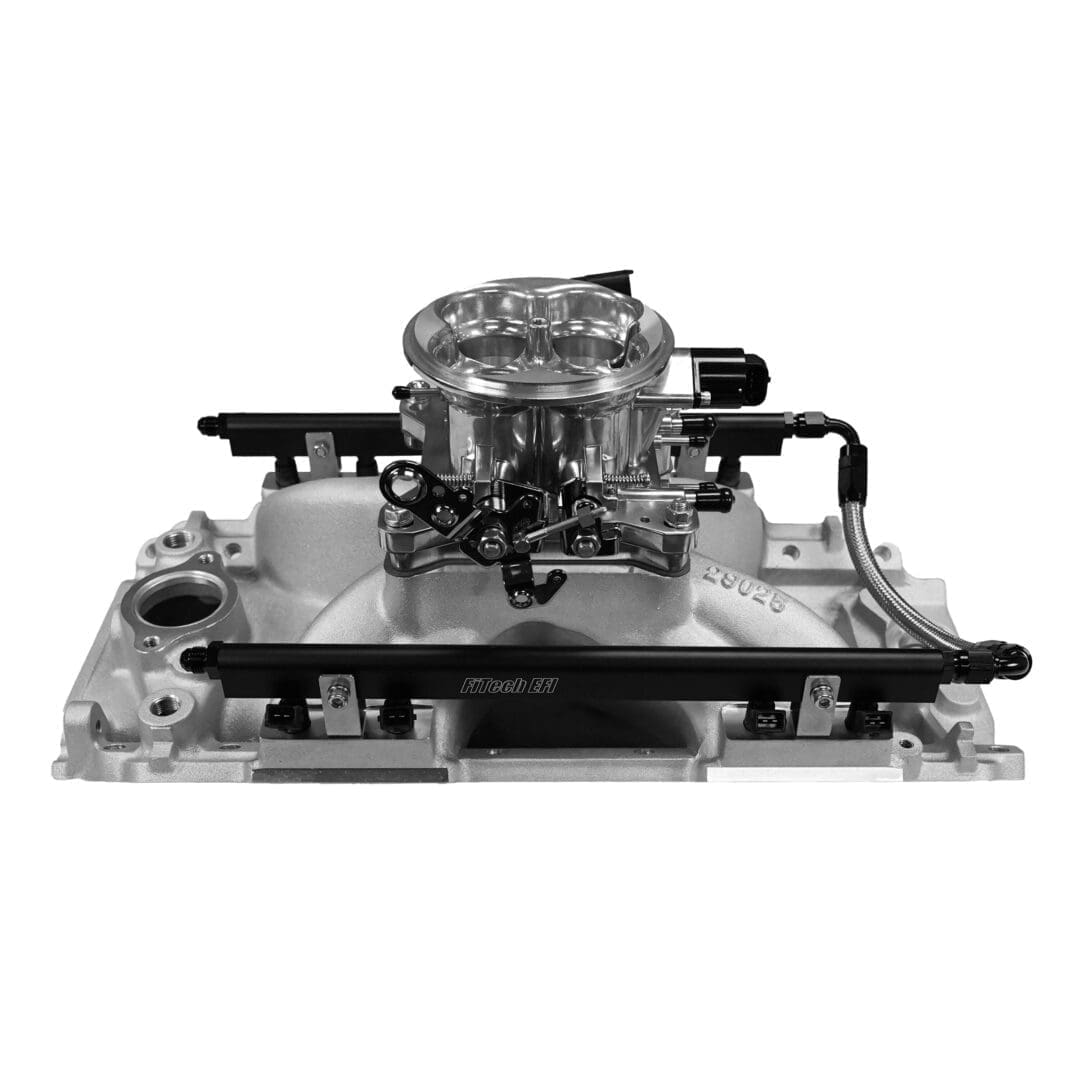 Carburetor and intake manifold assembly, black and white.