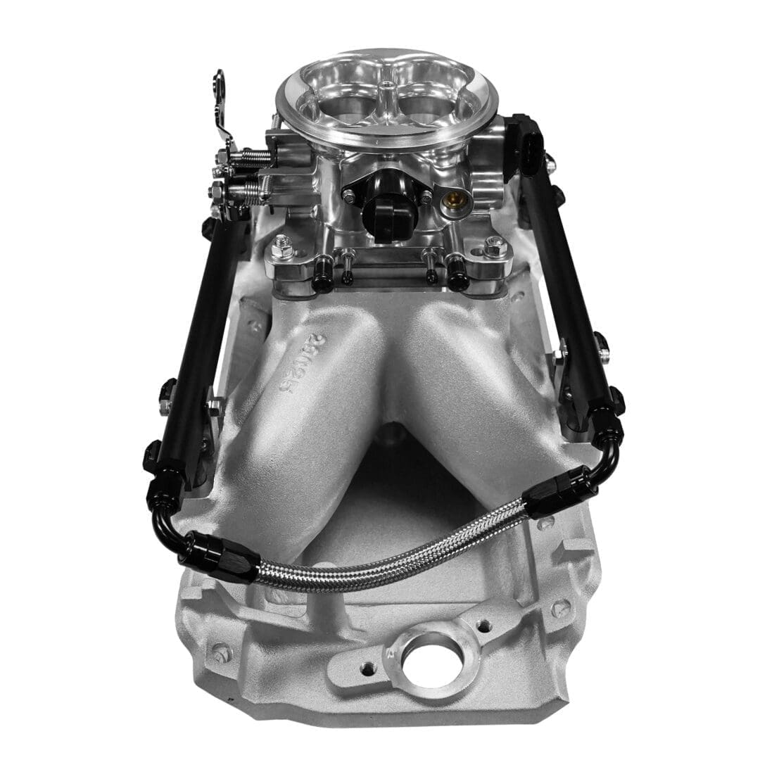 Car engine intake manifold on white background.