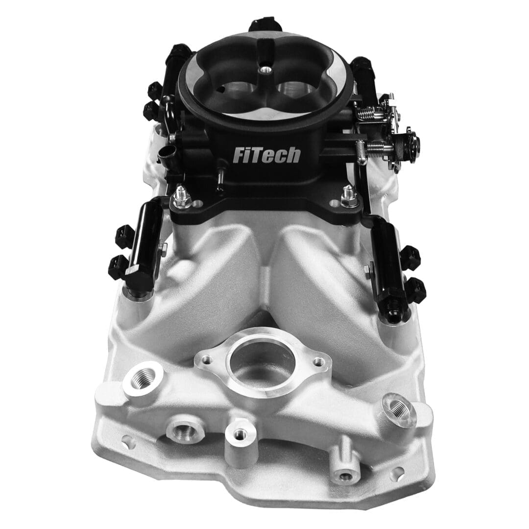 FiTech automotive engine component, black and silver.