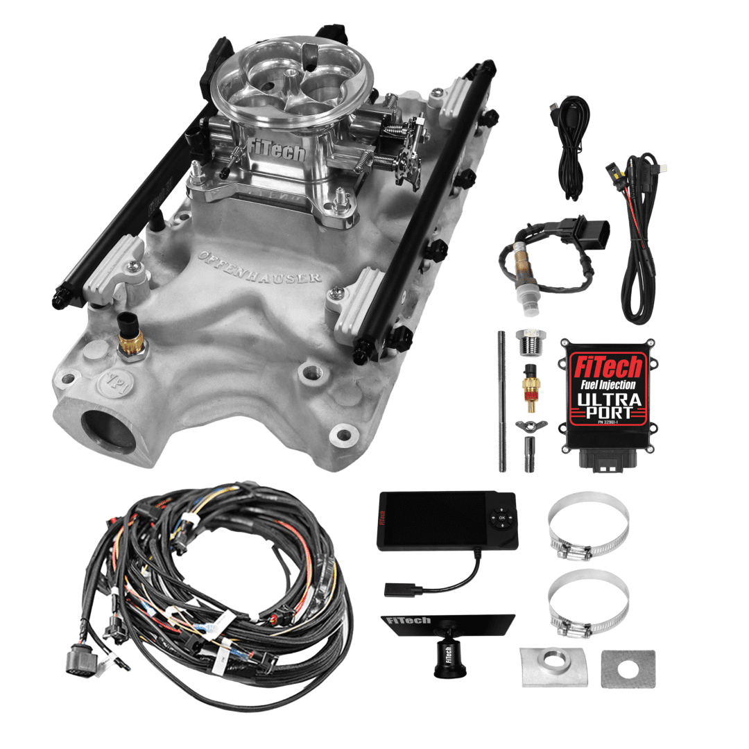 Carburetor and parts laid out on display.