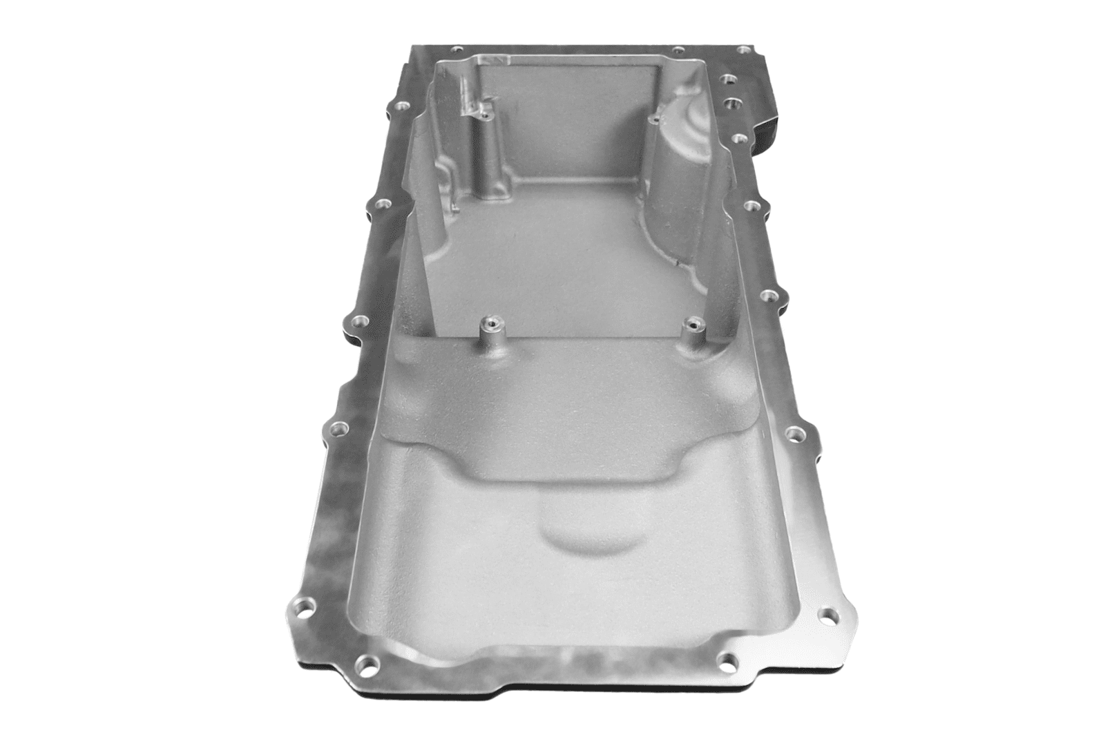 Silver automotive oil pan, isolated on white.