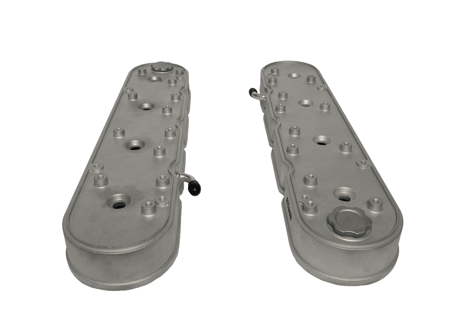 Two metal valve covers on black background.