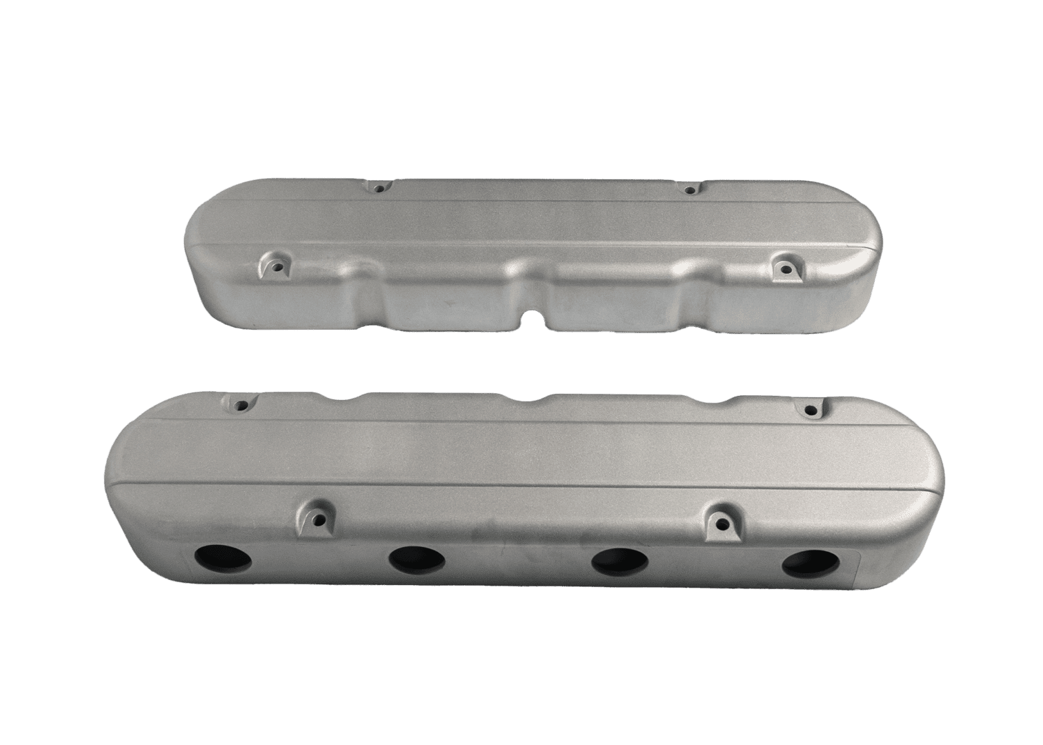 Silver engine covers on a black background.