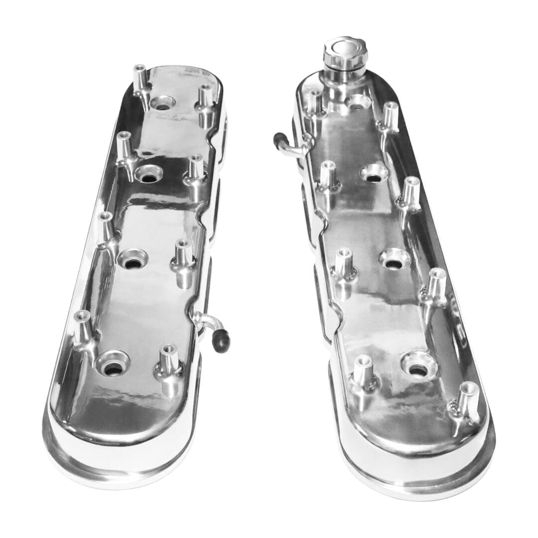 Chrome engine valve covers, isolated, white background.