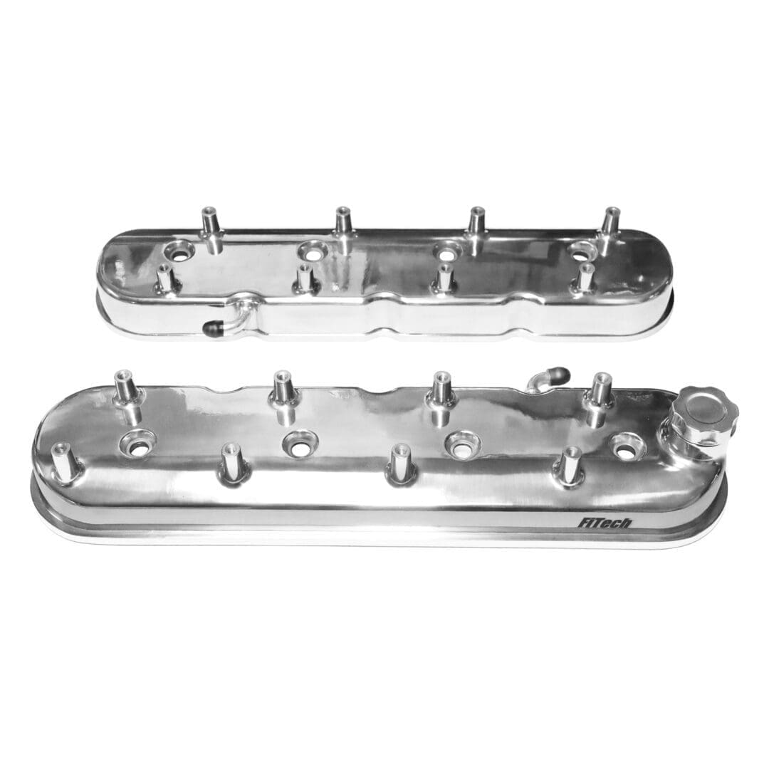 Chrome engine valve covers on white background.