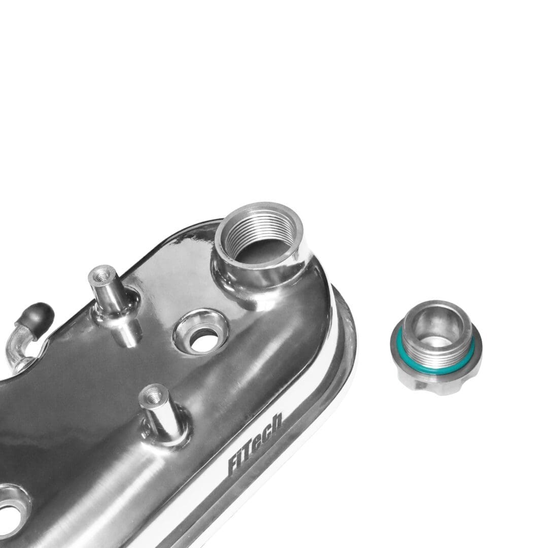 Car engine component with multiple connectors.