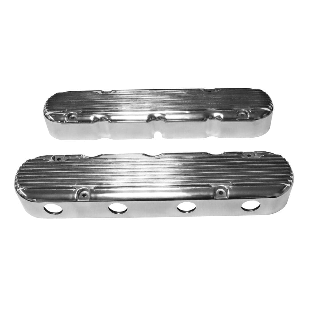 Chrome engine valve covers on white background.