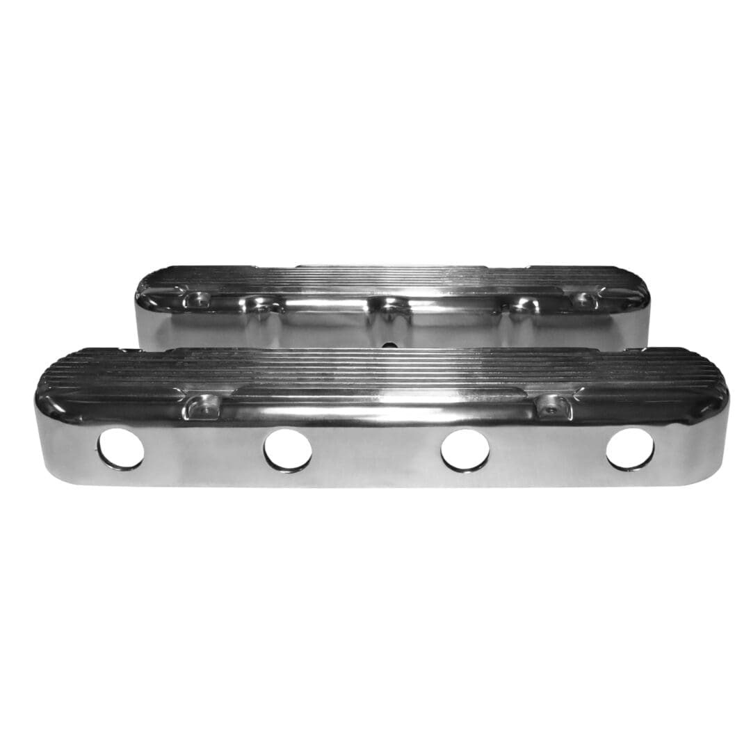 Chrome engine valve covers with ribbed design.
