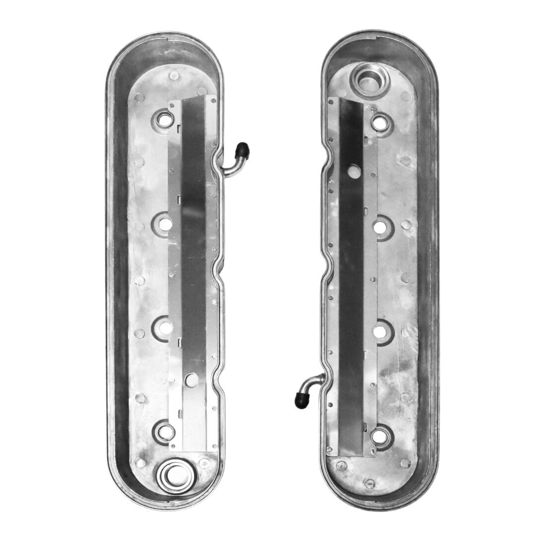 Metal valve covers with mounting hooks.
