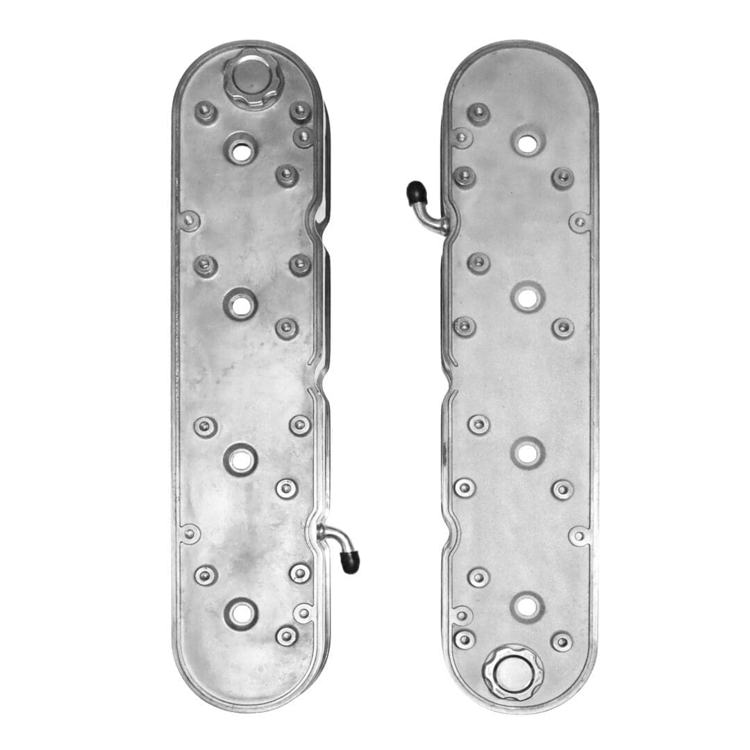 Engine valve covers with multiple bolt holes.