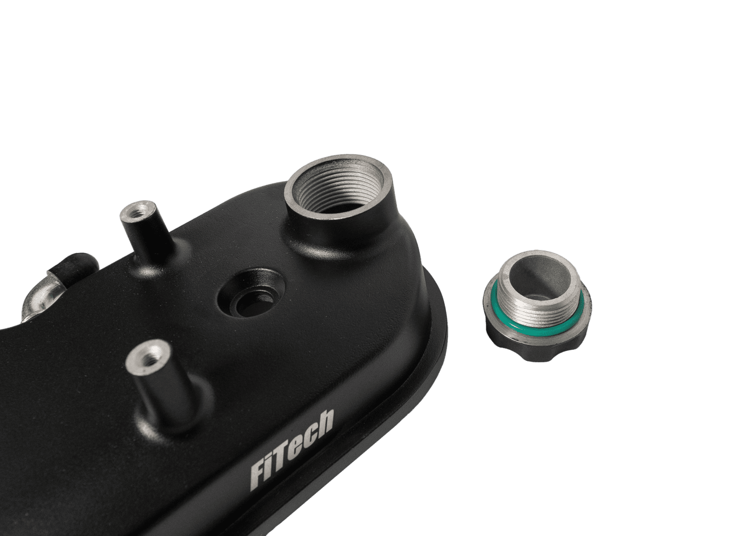 Black engine part with metal fittings.