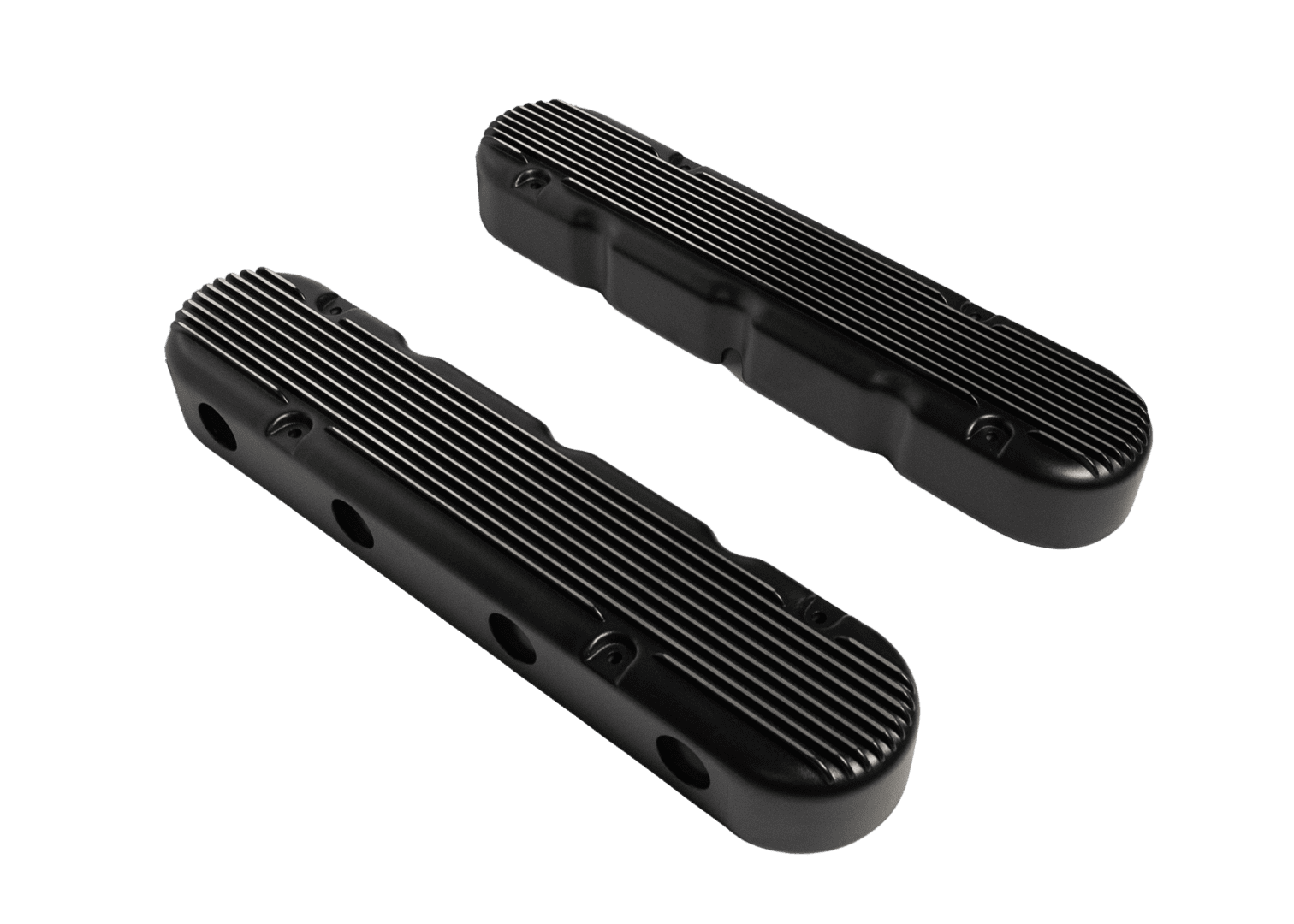 Black engine valve covers on black background.