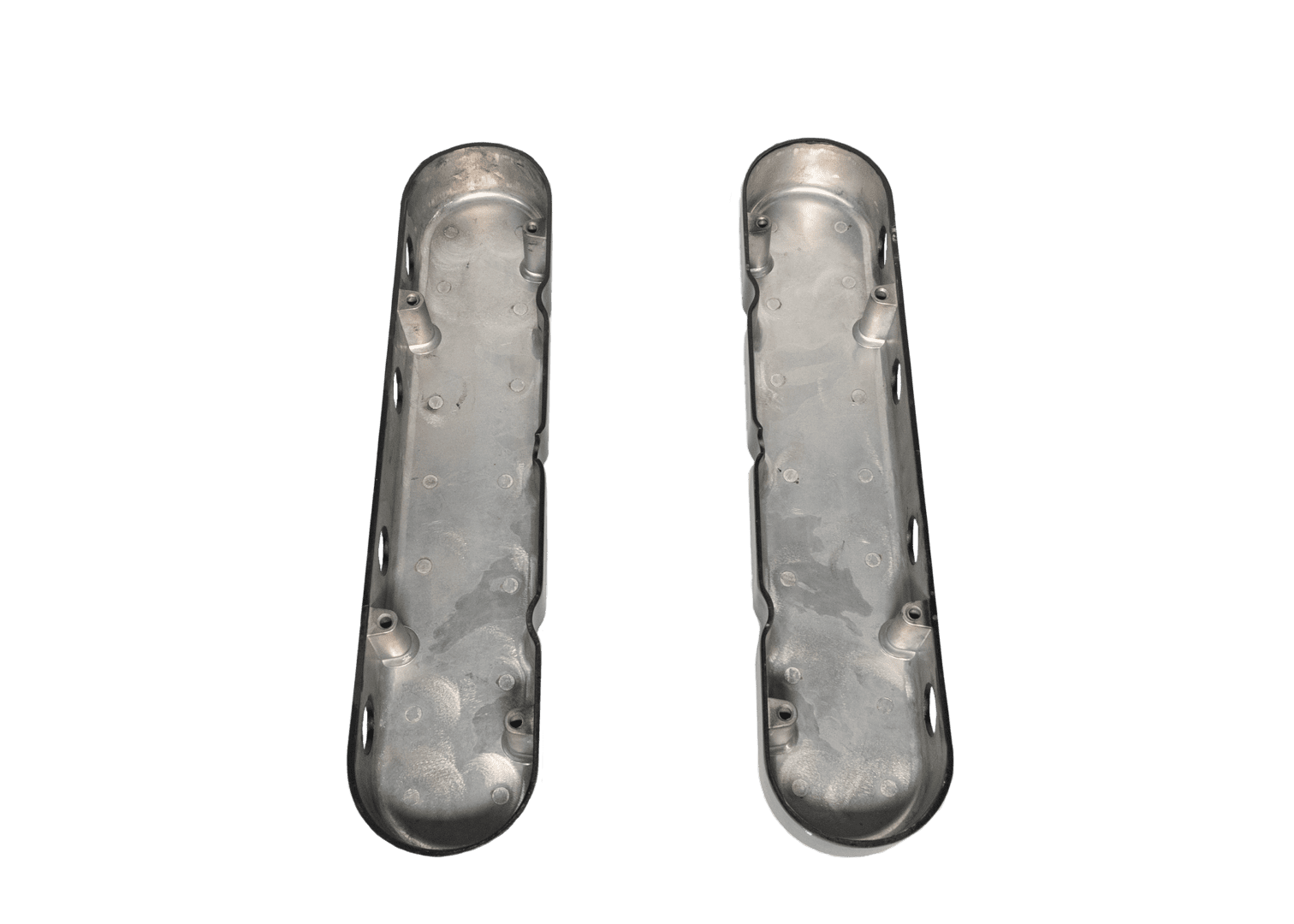 Two silver metallic engine valve covers.