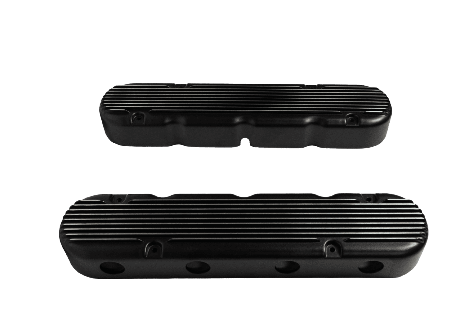 Black engine valve covers on black background.