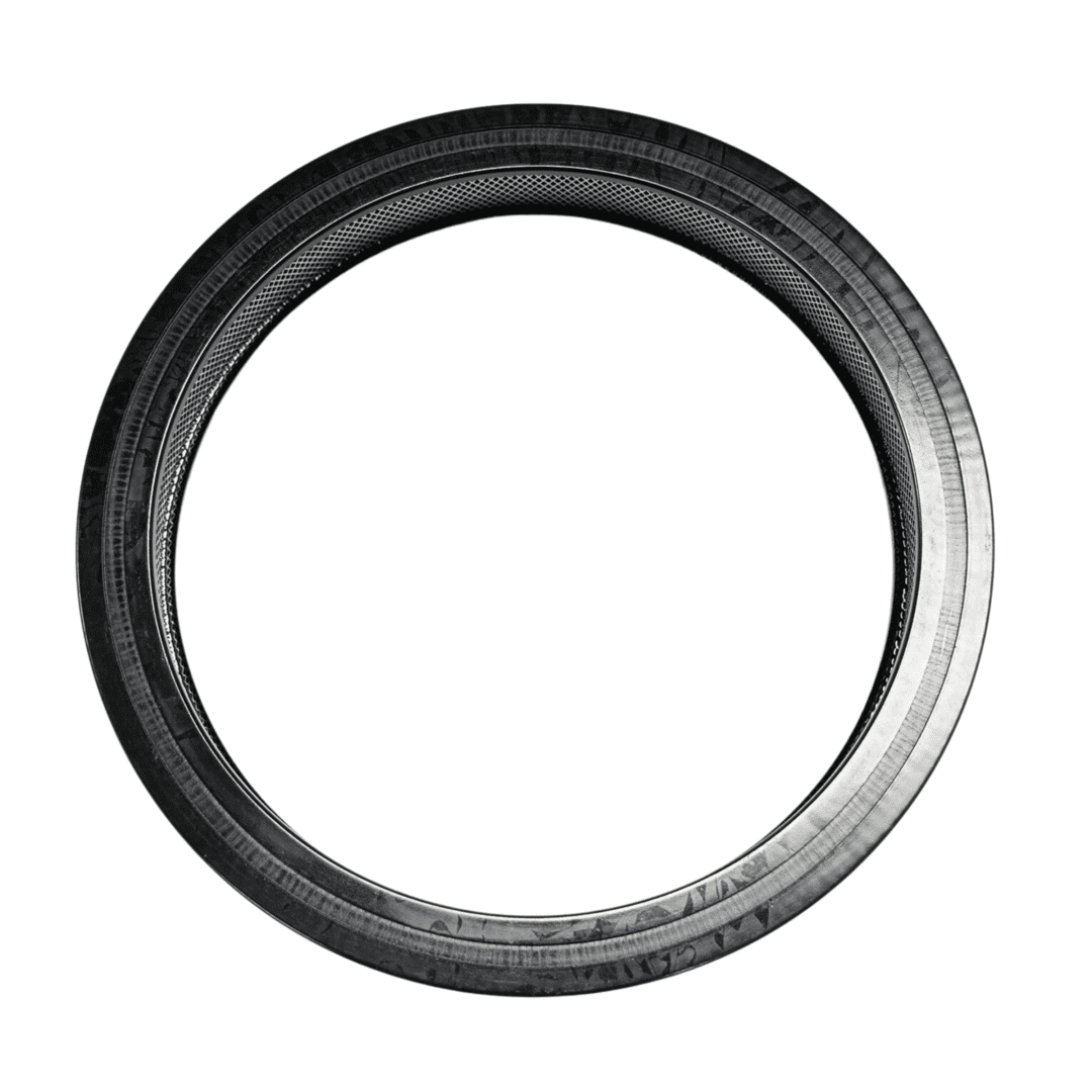 Black circular tire with textured inner edge.