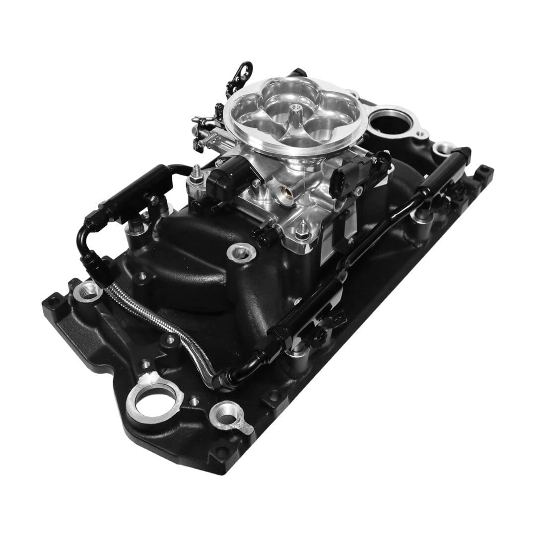 Car engine carburetor on intake manifold.