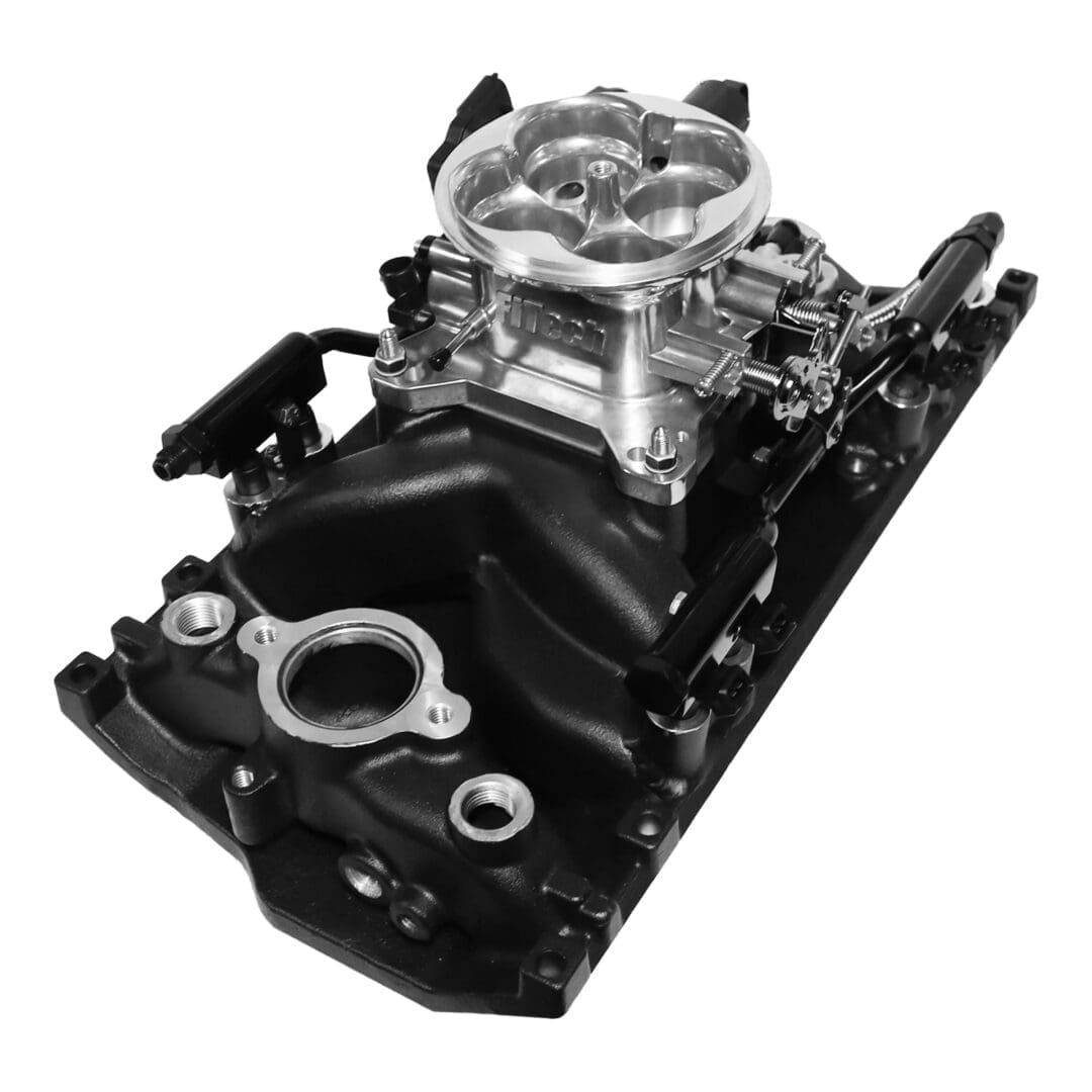 Engine intake manifold with carburetor, black finish.