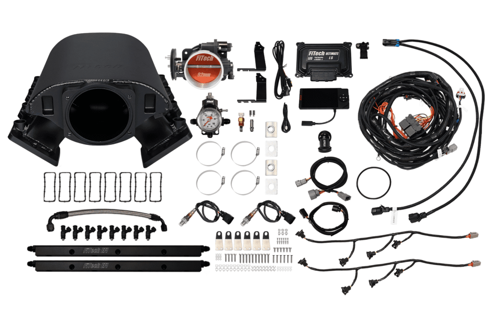 Car engine components and wiring kit displayed.